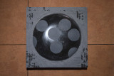 Felizitas Moroder, <em>O.T., </em>2026, Belgian marble, canned goods, 60 × 60 × 8 cm – Thumbnail preview