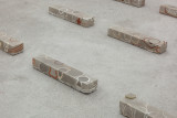 Javier Carro Temboury, <em>Café Transversal III</em>, 2024, Ceramic cups and dishes, coffee leftovers, cast in concrete then sliced; Wooden table, sliced – Thumbnail preview