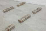 Javier Carro Temboury, <em>Café Transversal III</em>, 2024, Ceramic cups and dishes, coffee leftovers, cast in concrete then sliced; Wooden table, sliced – Thumbnail preview