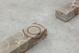 Javier Carro Temboury, <em>Café Transversal III</em>, 2024, Ceramic cups and dishes, coffee leftovers, cast in concrete then sliced; Wooden table, sliced – Thumbnail preview