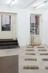 Javier Carro Temboury, <em>Café Transversal III</em>, 2024, Ceramic cups and dishes, coffee leftovers, cast in concrete then sliced; Wooden table, sliced – Thumbnail preview