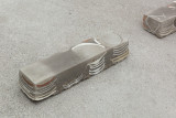 Javier Carro Temboury, <em>Café Transversal III</em>, 2024, Ceramic cups and dishes, coffee leftovers, cast in concrete then sliced; Wooden table, sliced – Thumbnail preview