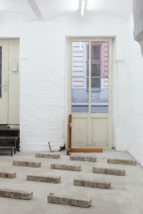 Javier Carro Temboury, <em>Café Transversal III</em>, 2024, Ceramic cups and dishes, coffee leftovers, cast in concrete then sliced; Wooden table, sliced – Thumbnail preview