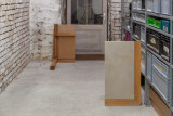 Javier Carro Temboury, <em>Café Transversal III</em>, 2024, Ceramic cups and dishes, coffee leftovers, cast in concrete then sliced; Wooden table, sliced – Thumbnail preview