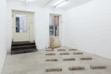 Javier Carro Temboury, <em>Café Transversal III</em>, 2024, Ceramic cups and dishes, coffee leftovers, cast in concrete then sliced; Wooden table, sliced – Thumbnail preview