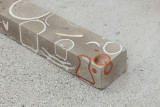 Javier Carro Temboury, <em>Café Transversal III</em>, 2024, Ceramic cups and dishes, coffee leftovers, cast in concrete then sliced; Wooden table, sliced – Thumbnail preview