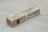 Javier Carro Temboury, <em>Café Transversal III</em>, 2024, Ceramic cups and dishes, coffee leftovers, cast in concrete then sliced; Wooden table, sliced – Thumbnail preview