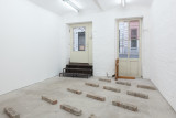 Javier Carro Temboury, <em>Café Transversal III</em>, 2024, Ceramic cups and dishes, coffee leftovers, cast in concrete then sliced; Wooden table, sliced – Thumbnail preview