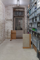 Javier Carro Temboury, <em>Café Transversal III</em>, 2024, Ceramic cups and dishes, coffee leftovers, cast in concrete then sliced; Wooden table, sliced – Thumbnail preview