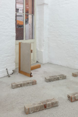 Javier Carro Temboury, <em>Café Transversal III</em>, 2024, Ceramic cups and dishes, coffee leftovers, cast in concrete then sliced; Wooden table, sliced – Thumbnail preview