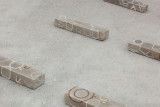 Javier Carro Temboury, <em>Café Transversal III</em>, 2024, Ceramic cups and dishes, coffee leftovers, cast in concrete then sliced; Wooden table, sliced – Thumbnail preview