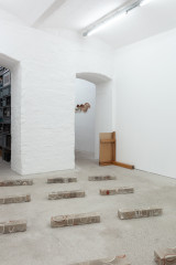 Javier Carro Temboury, <em>Café Transversal III</em>, 2024, Ceramic cups and dishes, coffee leftovers, cast in concrete then sliced; Wooden table, sliced – Thumbnail preview