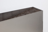 Rosario Aninat and Simon Shim-Sutcliffe, <em>Baby Teeth</em>, 2024, Stainless steel, dirt, typographic sorts (detail) – Thumbnail preview